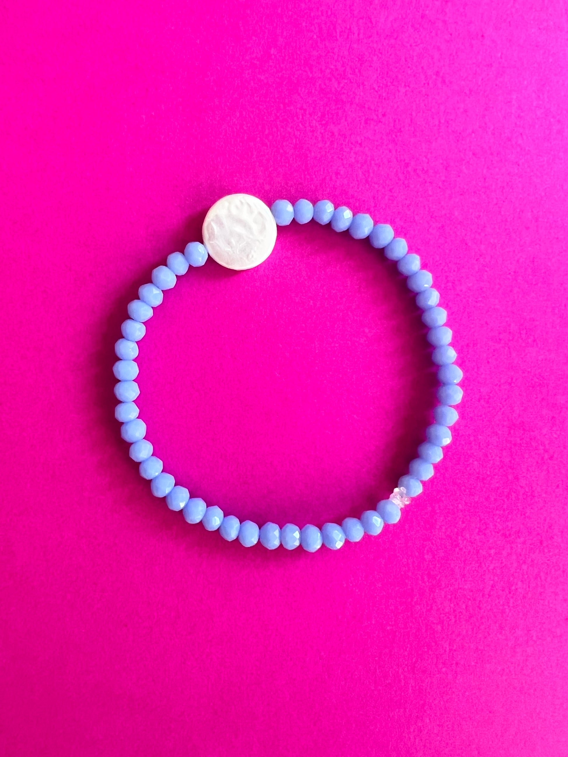Bracelet mille et une facettes et perle plate en nacre